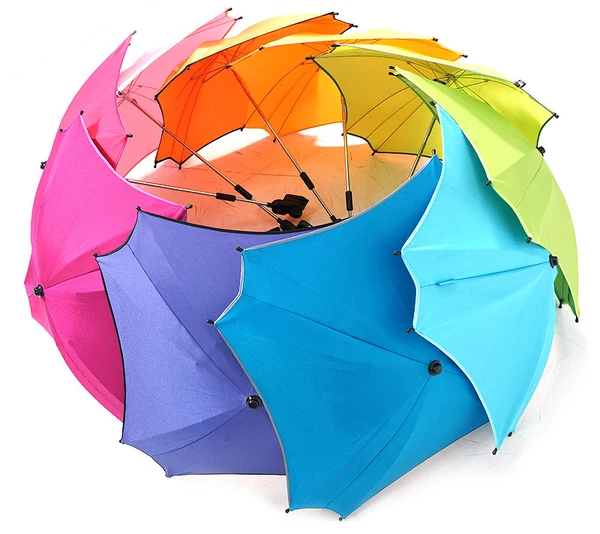 Multiple colorful small umbrellas arranged in a circular pinwheel pattern with bright rainbow colors on a white background, evoking playful nursery decor.